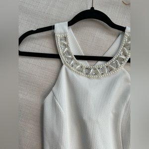 White dress with pearls